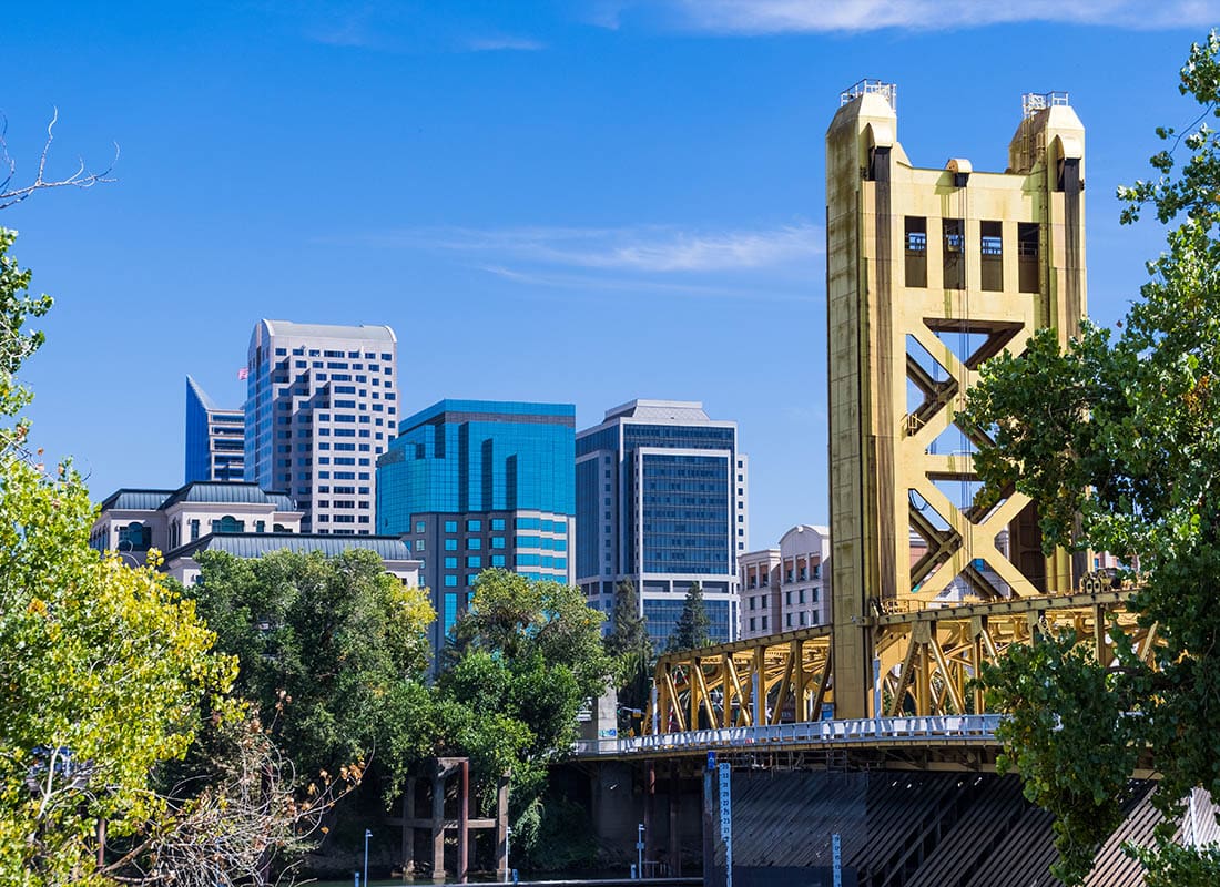 Sacramento, CA - View Towards the Tower Bridge and the Skyscrapers in Downtown Sacramento on a Sunny Day